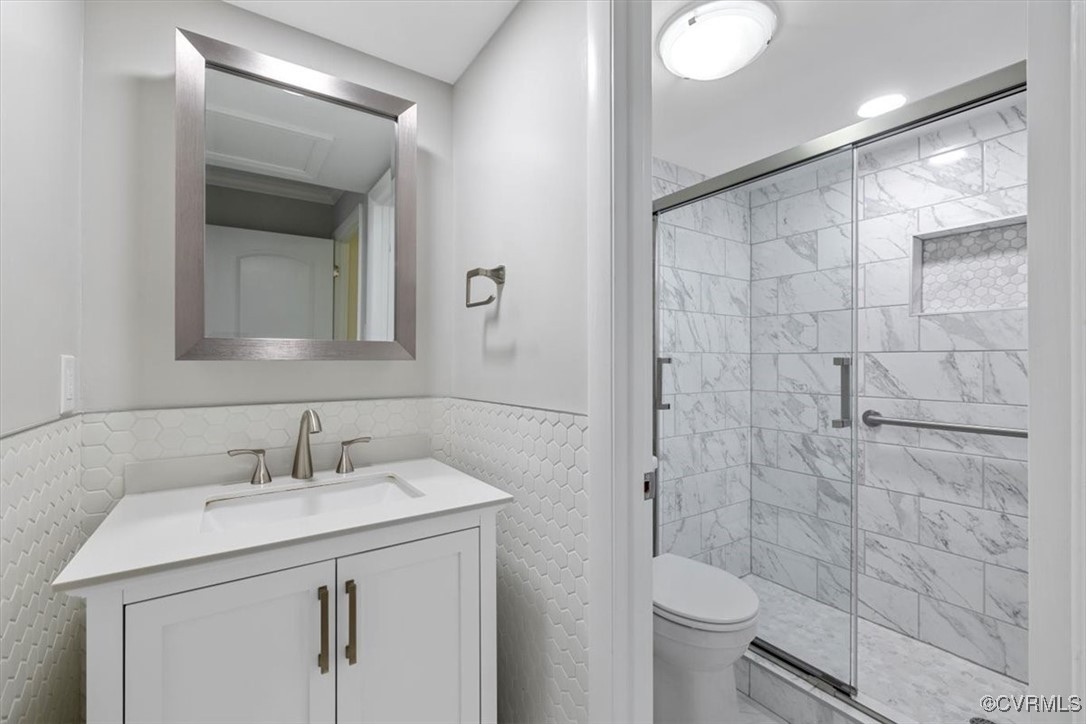 1501 Thistle Road, Unit 203 Richmond, VA 23238 - Photo 13 of 30 a bathroom with a sink toilet and shower