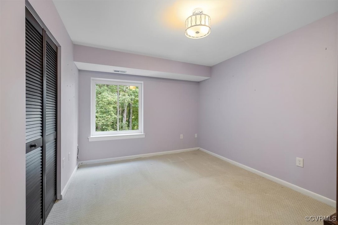 1501 Thistle Road, Unit 203 Richmond, VA 23238 - Photo 14 of 30 an empty room with a window