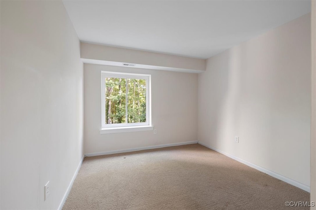 1501 Thistle Road, Unit 203 Richmond, VA 23238 - Photo 15 of 30 an empty room with windows