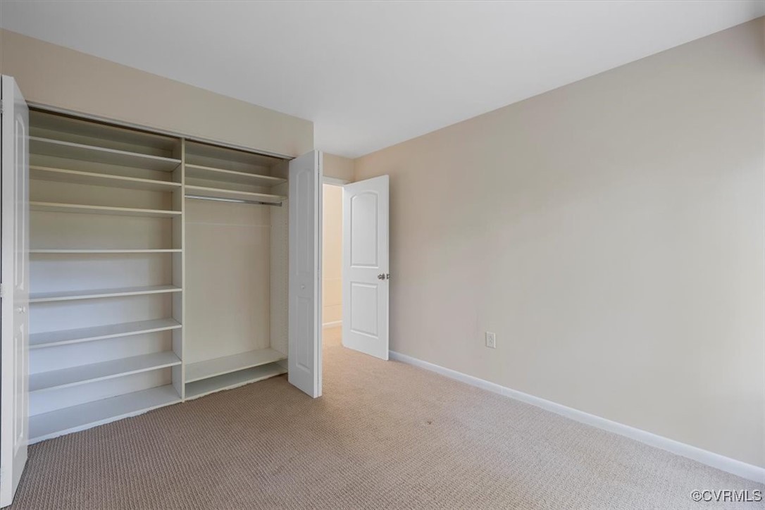 1501 Thistle Road, Unit 203 Richmond, VA 23238 - Photo 16 of 30 a view of an empty room with shelves