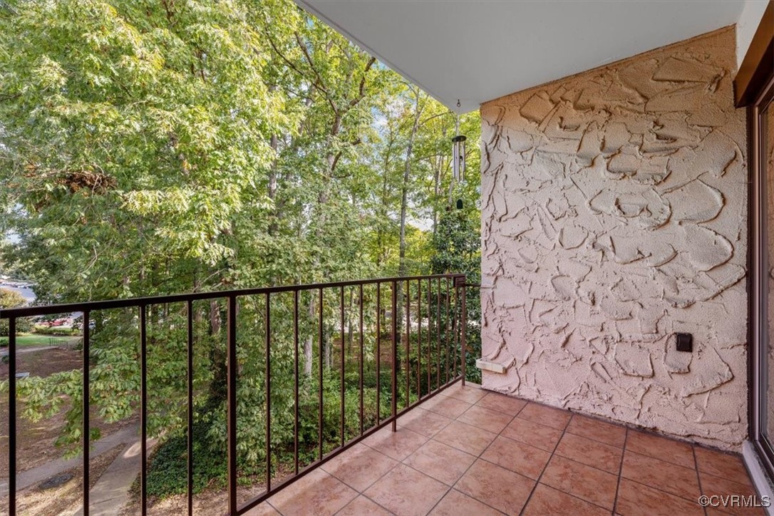 1501 Thistle Road, Unit 203 Richmond, VA 23238 - Photo 21 of 30 a balcony with an outdoor space