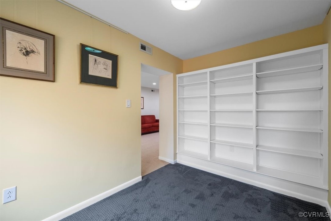 1501 Thistle Road, Unit 203 Richmond, VA 23238 - Photo 10 of 30 a view of an empty room with empty shelves
