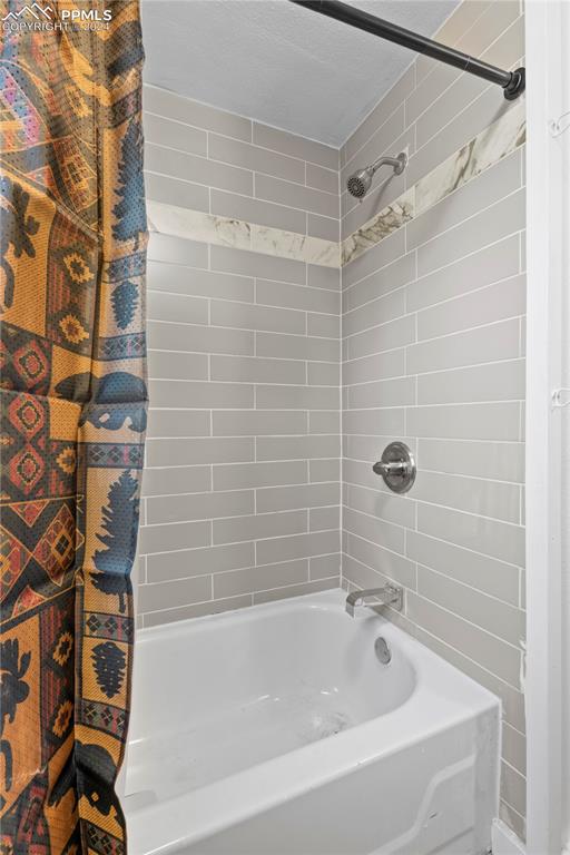 455 Golden Bell Lane Divide, CO 80814 - Photo 16 of 30 a bathroom with a shower and a bathtub