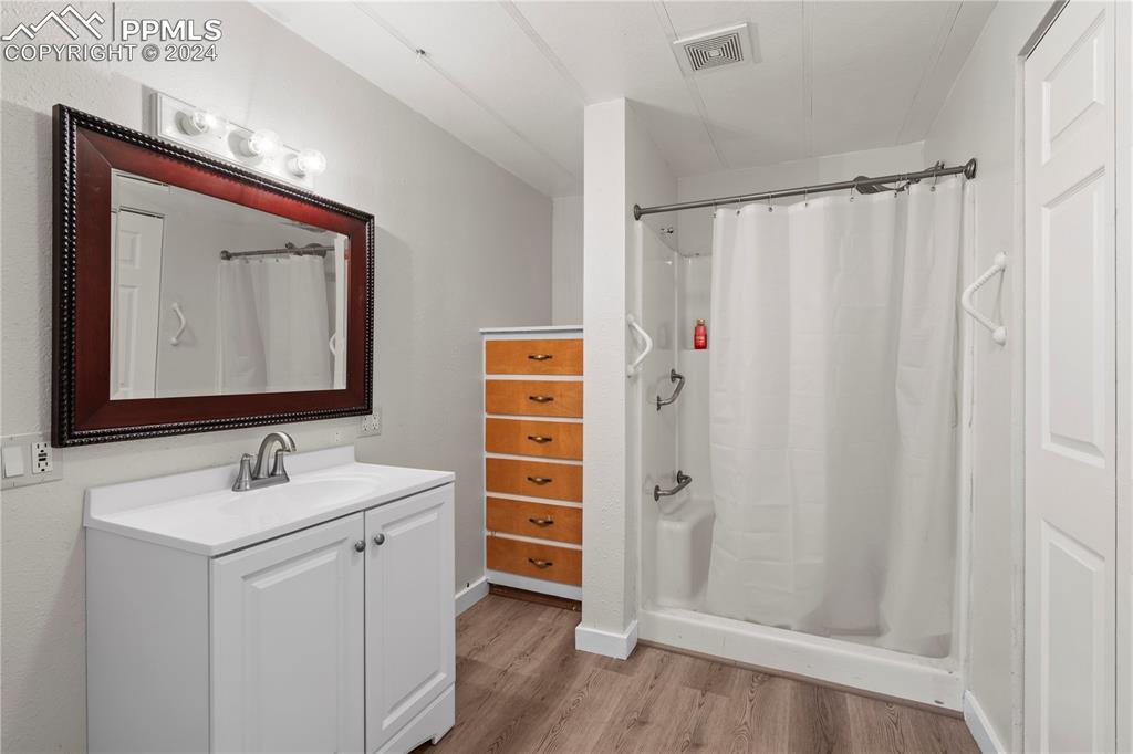 455 Golden Bell Lane Divide, CO 80814 - Photo 19 of 30 a bathroom with a sink and a mirror