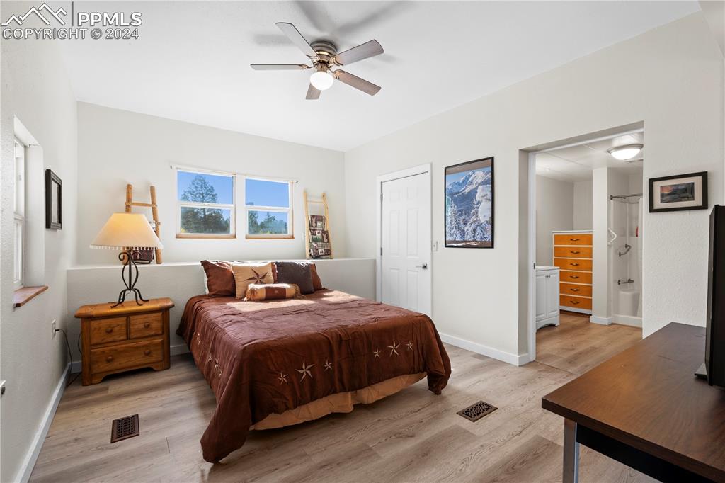 455 Golden Bell Lane Divide, CO 80814 - Photo 20 of 30 a bedroom with a bed and a table in it