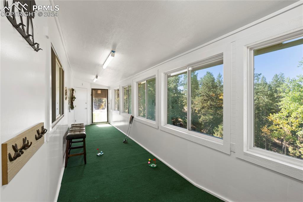 455 Golden Bell Lane Divide, CO 80814 - Photo 23 of 30 a spacious bedroom with a bed and a window