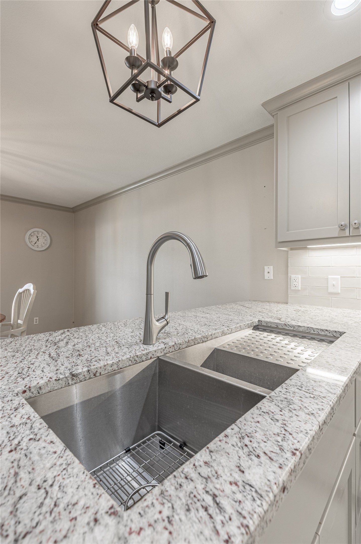 22 Timberwilde Drive Huntsville, TX 77320 - Photo 14 of 44 a kitchen with a sink granite counter tops and a view of living room