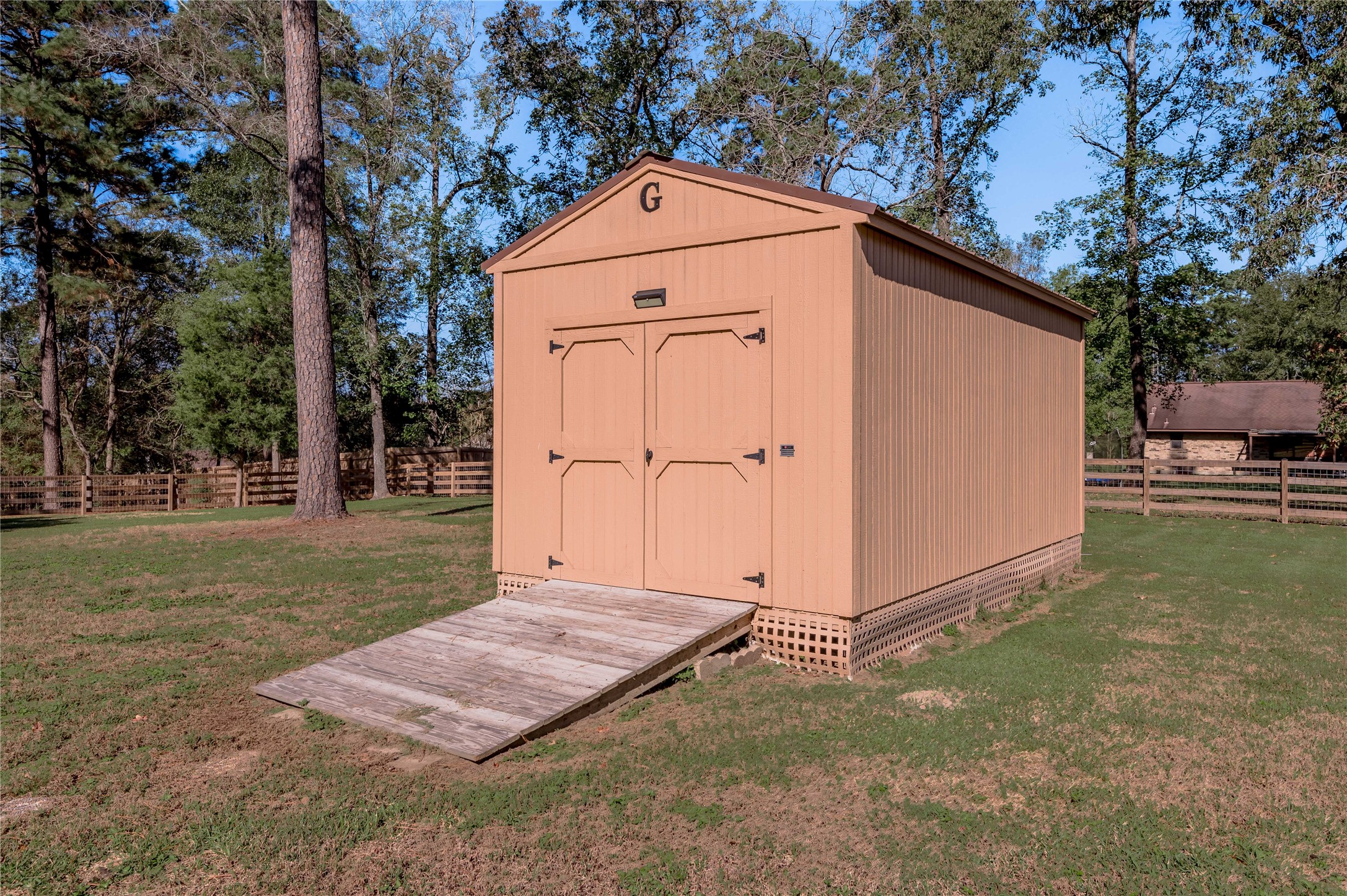 22 Timberwilde Drive Huntsville, TX 77320 - Photo 42 of 44 Storage building w/lighting