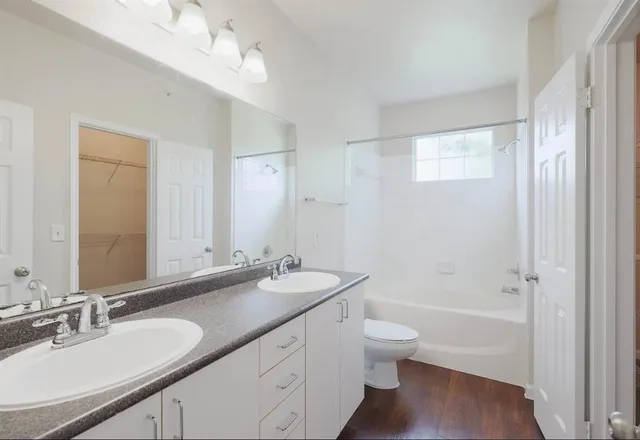 a bathroom with a shower and a sink