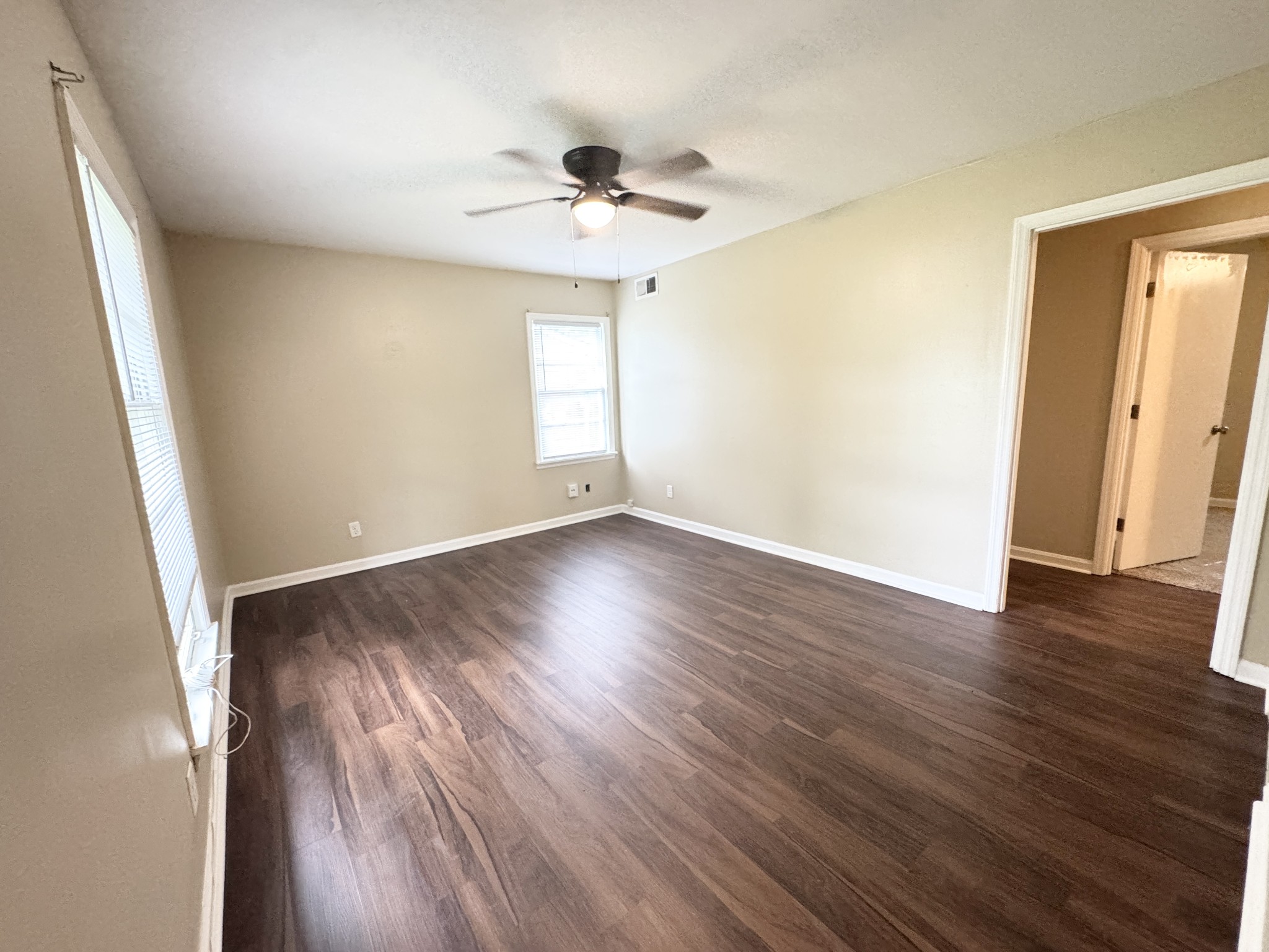 3824 Cazassa Road Memphis, TN 38116 - Photo 4 of 25 wooden floor in an empty room with a window