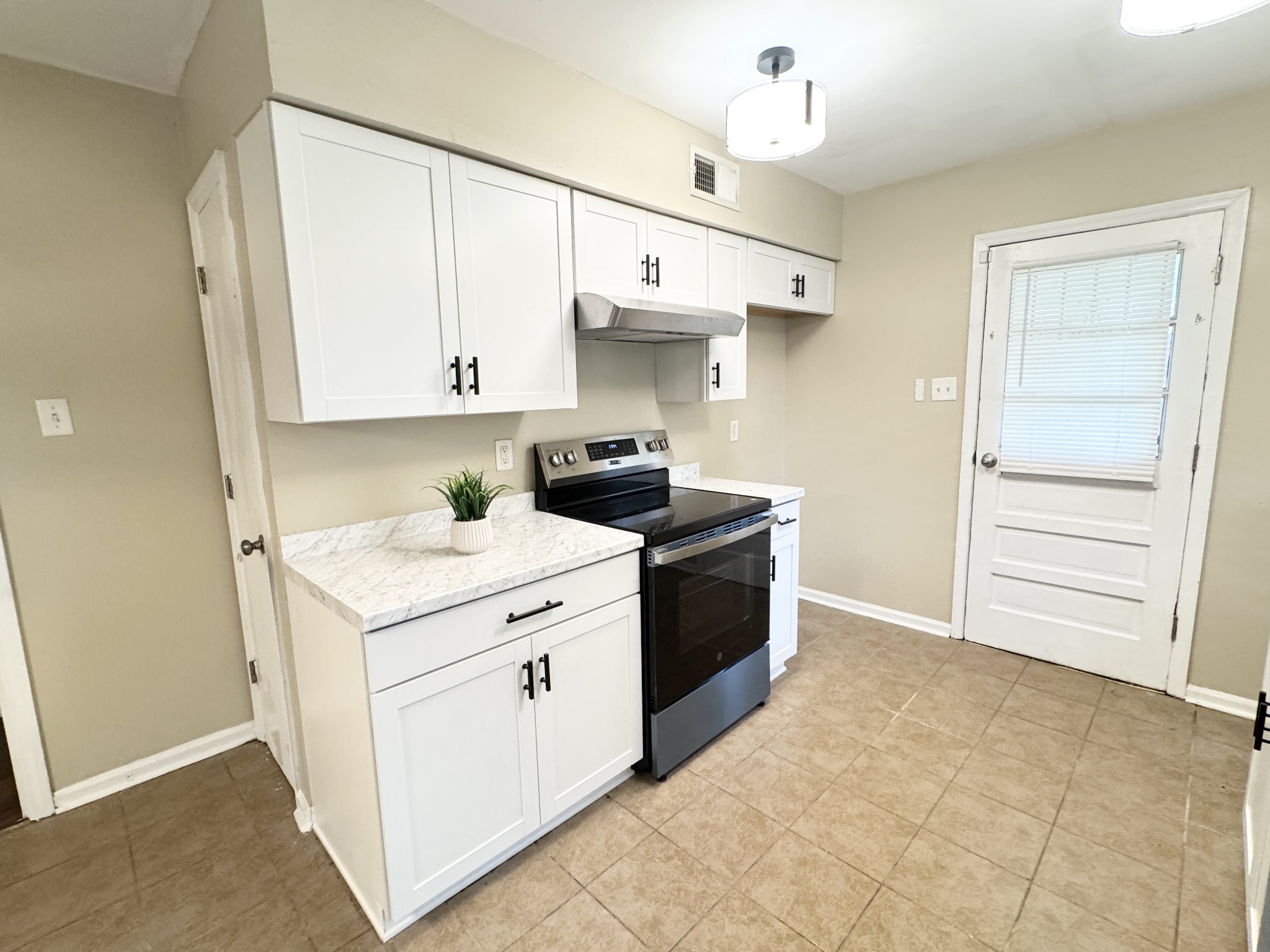 3824 Cazassa Road Memphis, TN 38116 - Photo 7 of 25 a kitchen with a sink and cabinets
