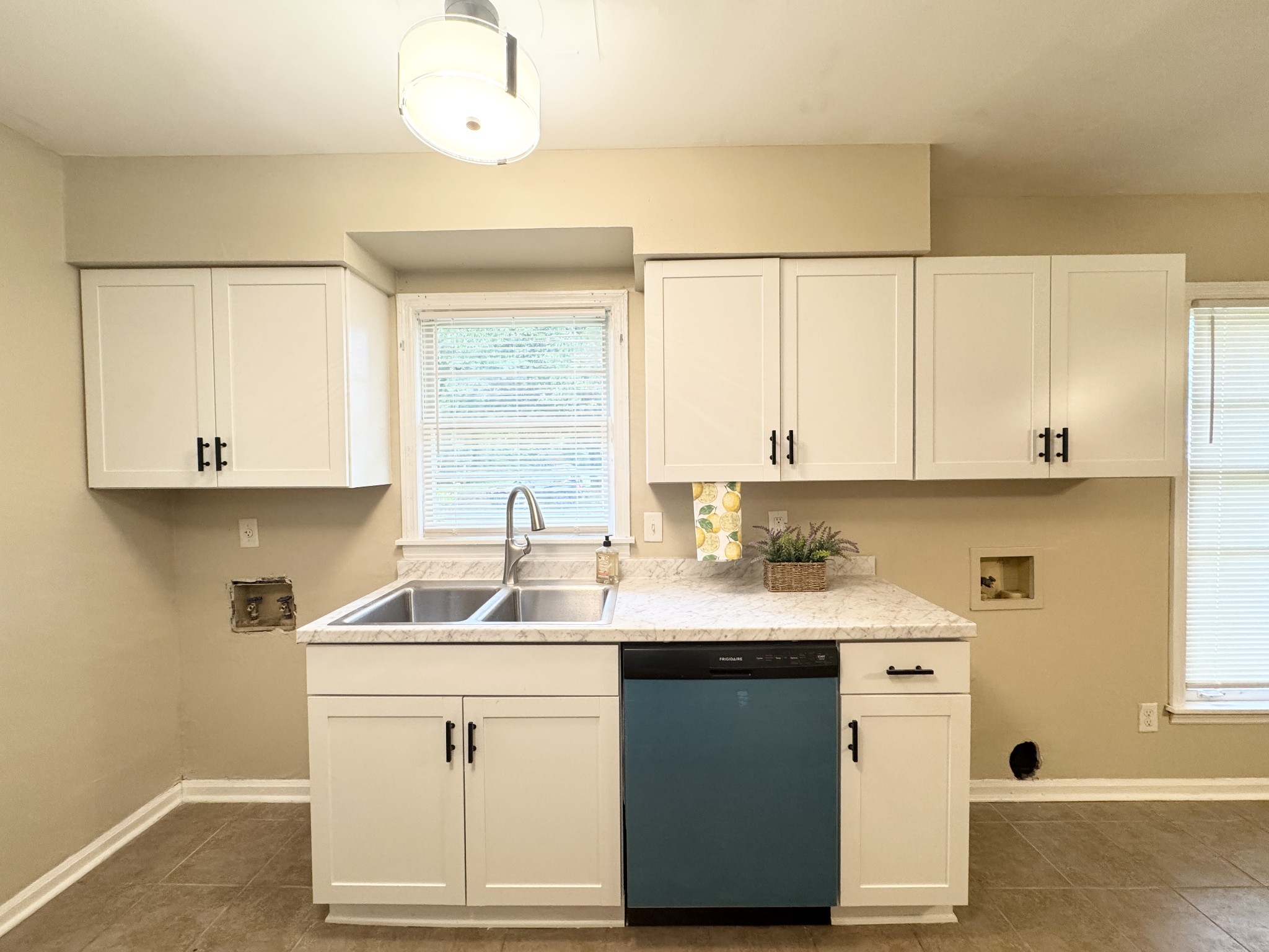3824 Cazassa Road Memphis, TN 38116 - Photo 8 of 25 a kitchen with a sink cabinets and window