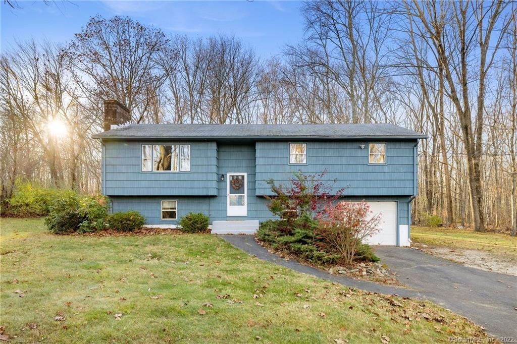323 Carpenter Road Coventry, CT 06238 - Photo 1 of 1 a front view of a house with garden