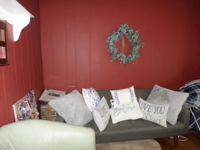 a bedroom with bed and a couch