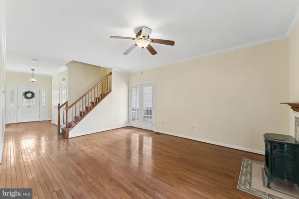a view of an entryway with wooden floor