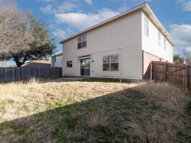 a house view with a backyard