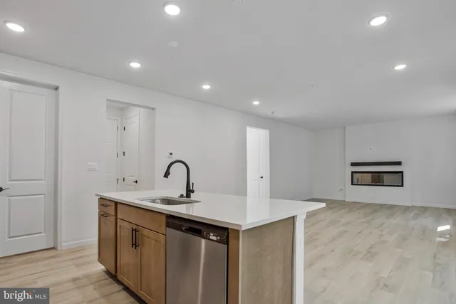 a kitchen with a sink and a refrigerator