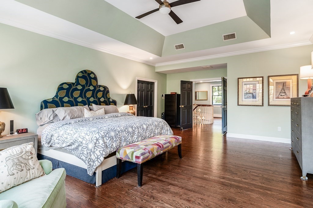 4 Bridle Path Lane Beverly, MA 01915 - Photo 21 of 42 a bedroom with a bed and wooden floor