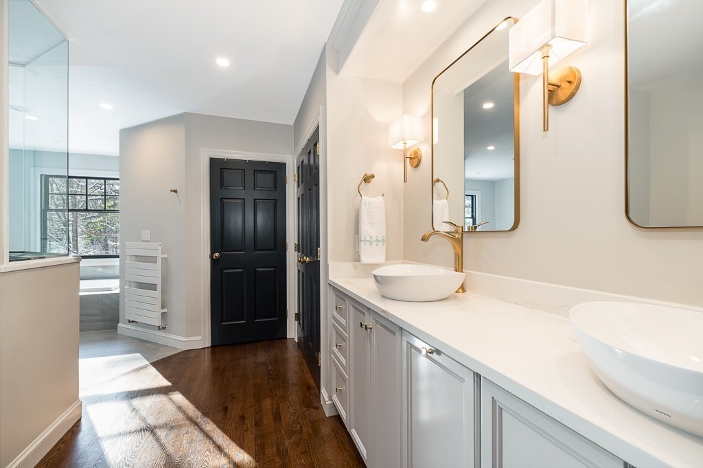 4 Bridle Path Lane Beverly, MA 01915 - Photo 24 of 42 a bathroom with a sink and a mirror