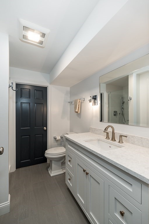 4 Bridle Path Lane Beverly, MA 01915 - Photo 35 of 42 a bathroom with a double vanity sink toilet and shower