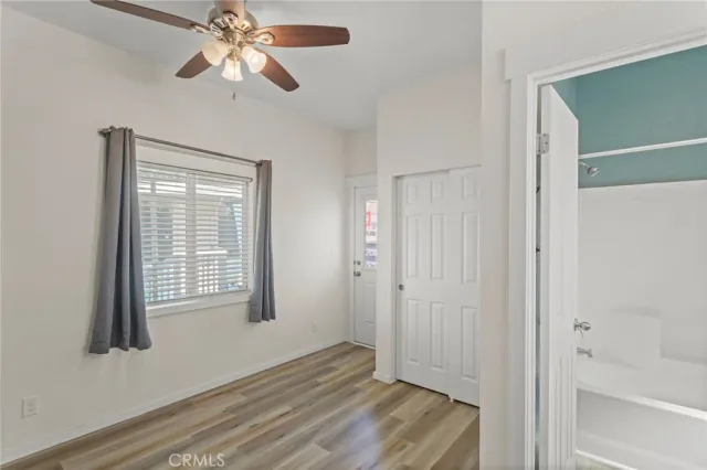 a view of a terrace with couches and wooden floor