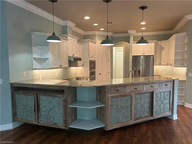 a bathroom with a double vanity sink and a large mirror
