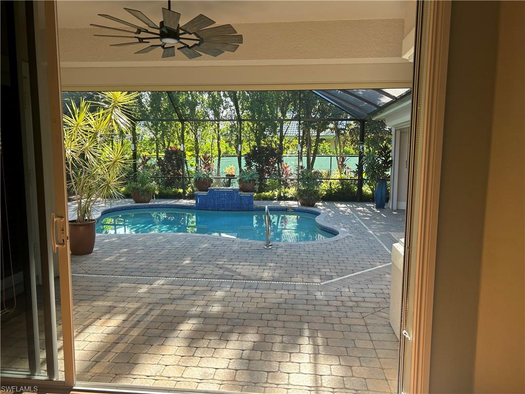 4956 Rustic Oaks Circle Naples, FL 34105 - Photo 9 of 10 a view of a porch and a yard