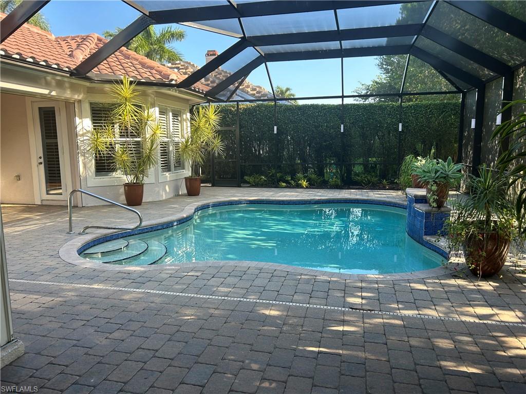 4956 Rustic Oaks Circle Naples, FL 34105 - Photo 10 of 10 a view of a swimming pool with a patio