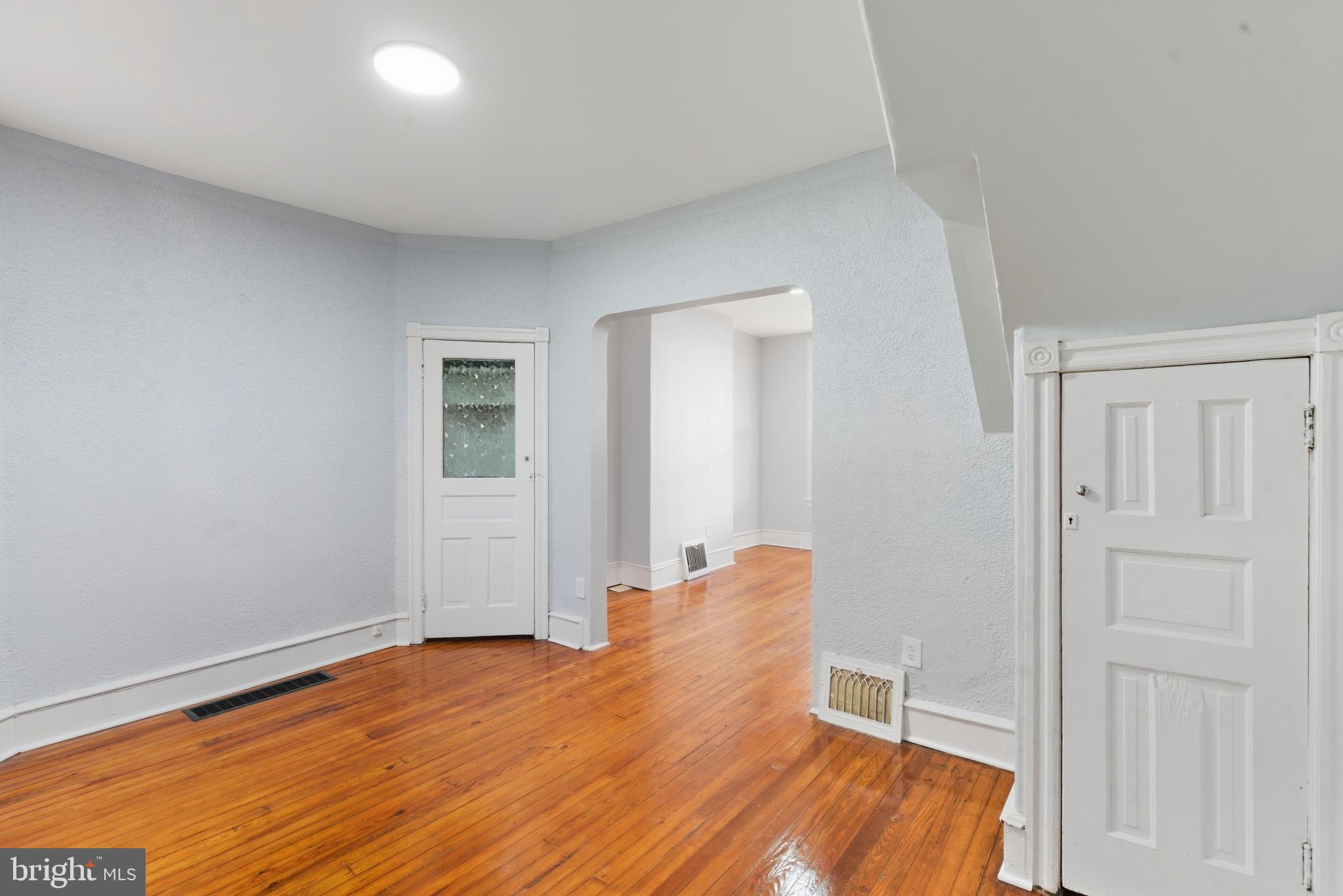 5632 Addison Street Philadelphia, PA 19143 - Photo 5 of 14 a view of a room with wooden floor and entryway