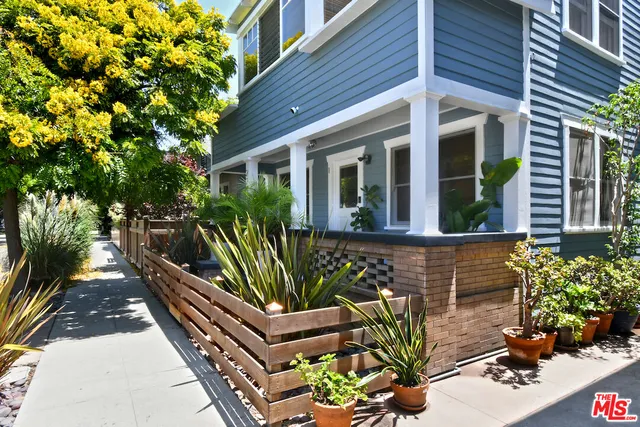 a view of a house with backyard sitting area