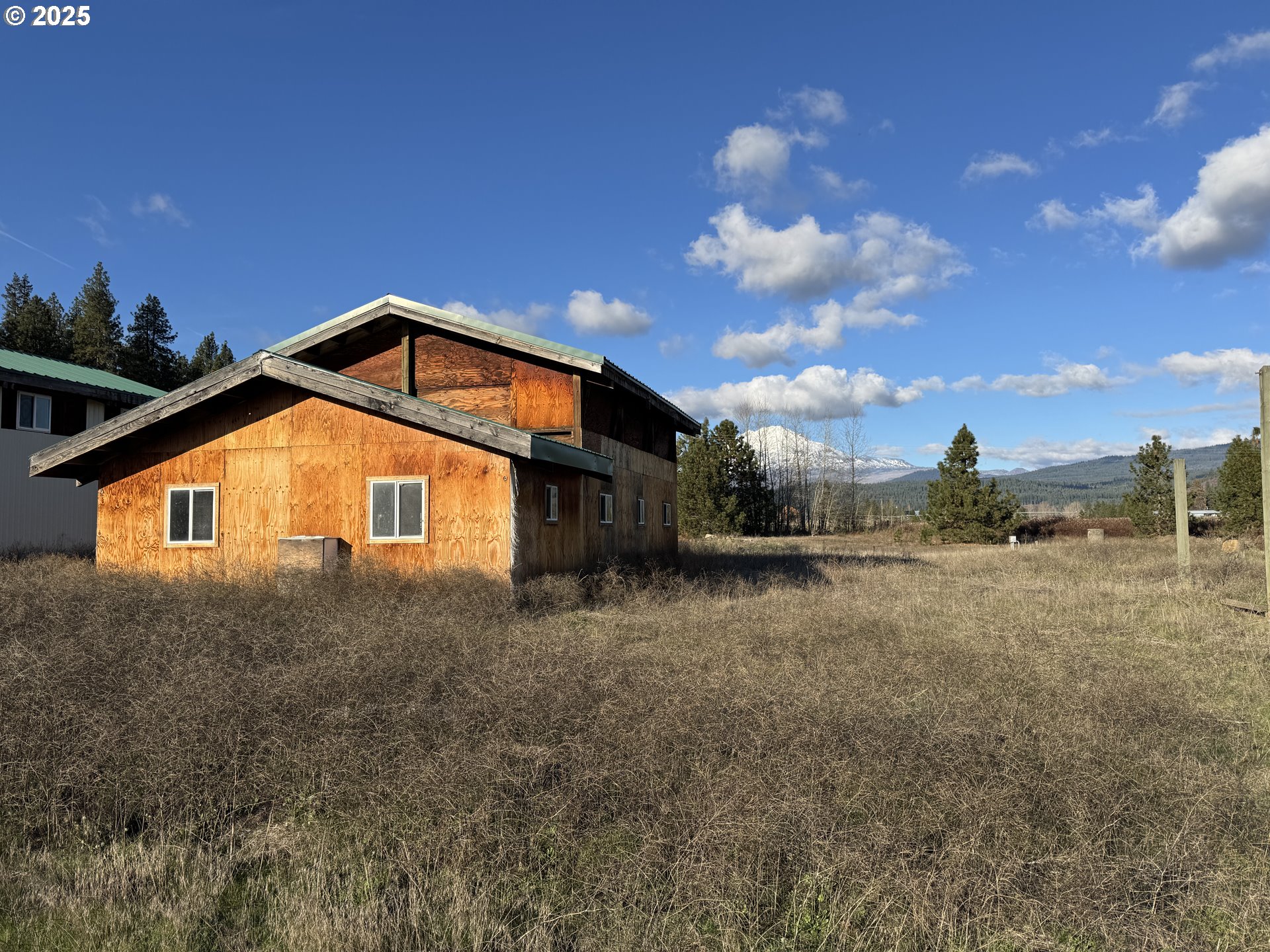 343 Little Mountain Road Trout Lake, WA 98650 - Photo 14 of 35 a view of a house with a yard
