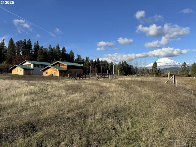 a view of outdoor space with playground and green space