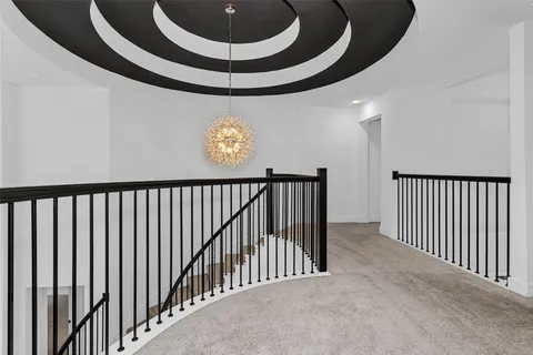 a view of a hallway with a chandelier