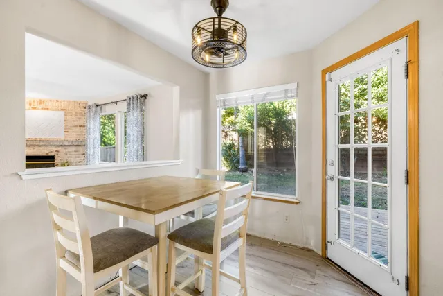 a view of a livingroom with furniture and a window