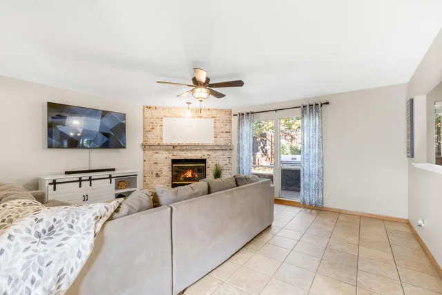 a view of a livingroom with furniture and a window