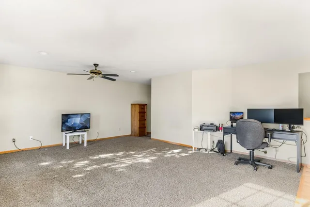 a bathroom with a double vanity sink a mirror and a bathtub