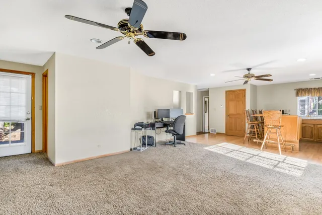 a living room with a bed furniture and a window
