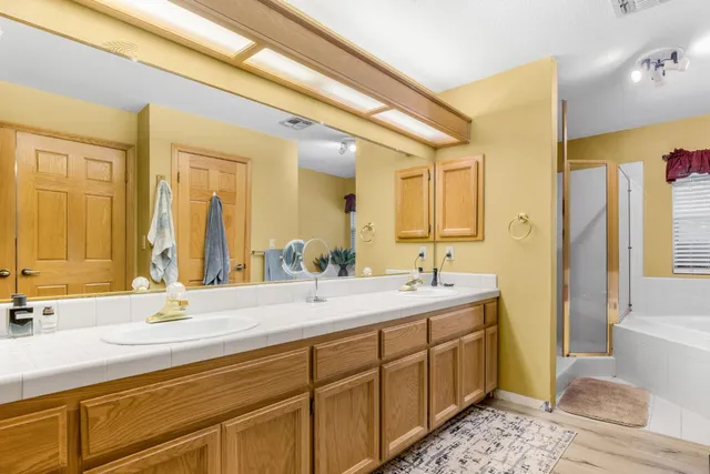 a view of backyard with a deck and wooden floor