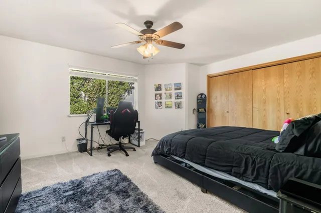 an aerial view of a house with a yard and garden