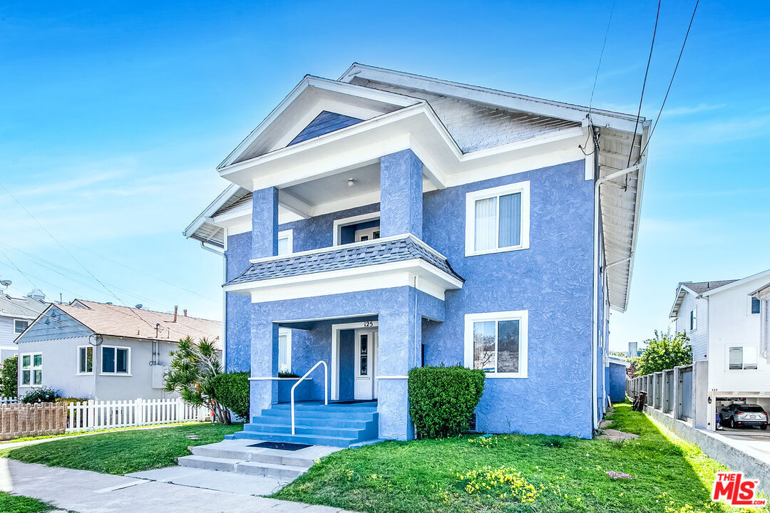 125 North Broadway, Unit 3 Redondo Beach, CA 90277 - Photo 1 of 12 a view of a house with brick walls and a yard with plants