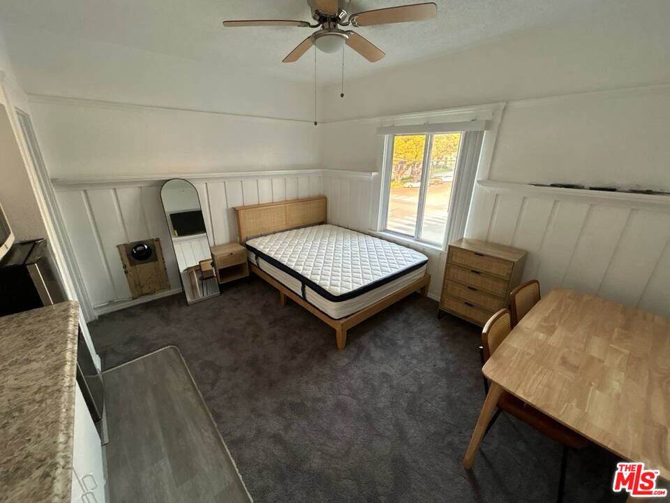 125 North Broadway, Unit 3 Redondo Beach, CA 90277 - Photo 3 of 12 a living room with furniture and a window