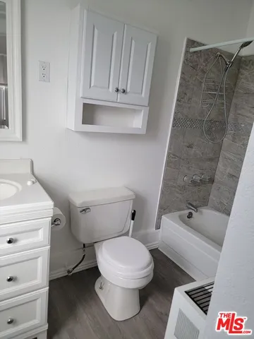 a bathroom with a toilet and a sink