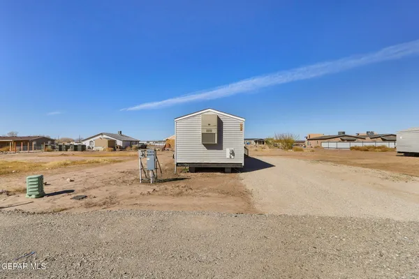 a view of a swimming pool with a yard