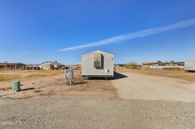 a view of a swimming pool with a yard