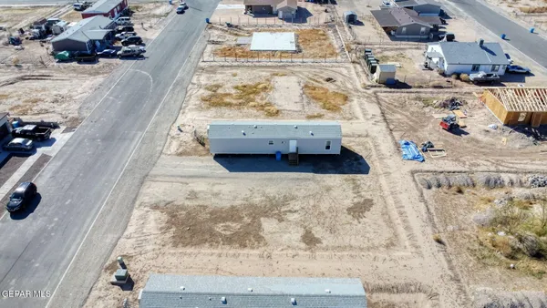 an aerial view of a house with a swimming pool