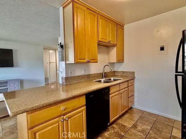a kitchen with stainless steel appliances a stove a microwave and cabinets