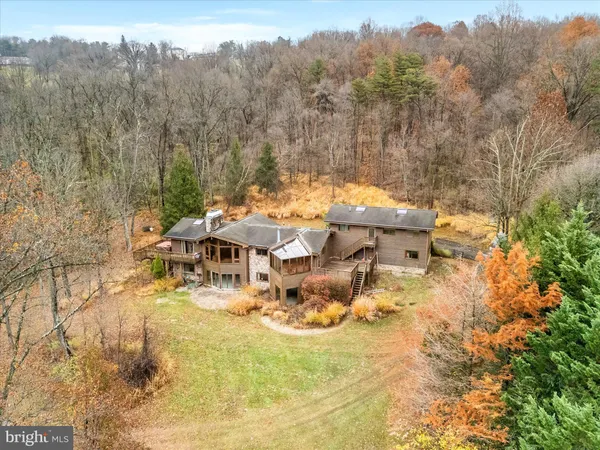 a view of a swimming pool with a patio and mountain view