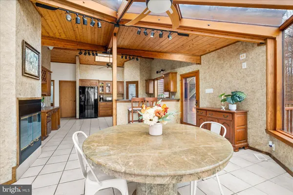 a view of a kitchen with furniture and a potted plant