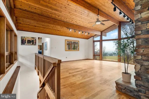 a view of an entryway with wooden floor