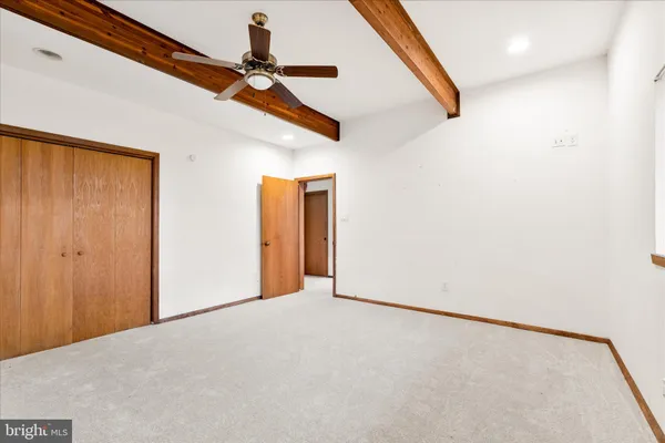 a view of a hallway with a window